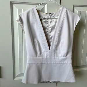 White stained lined Bebe Blouse.